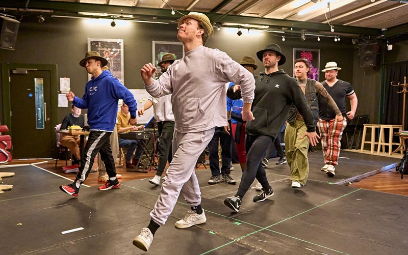 Cast of Guys and Dolls in rehearsal