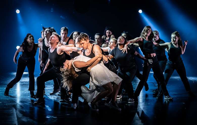 (Centre) Martha Kirby (Eva Perón) and Dan Partridge (Magaldi) and the cast of Evita (photography by Marc Brenner)
